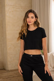 Pijama negra de mujer en 100% algodón, crop top y pantalón largo cómodo para uso diario y descanso.